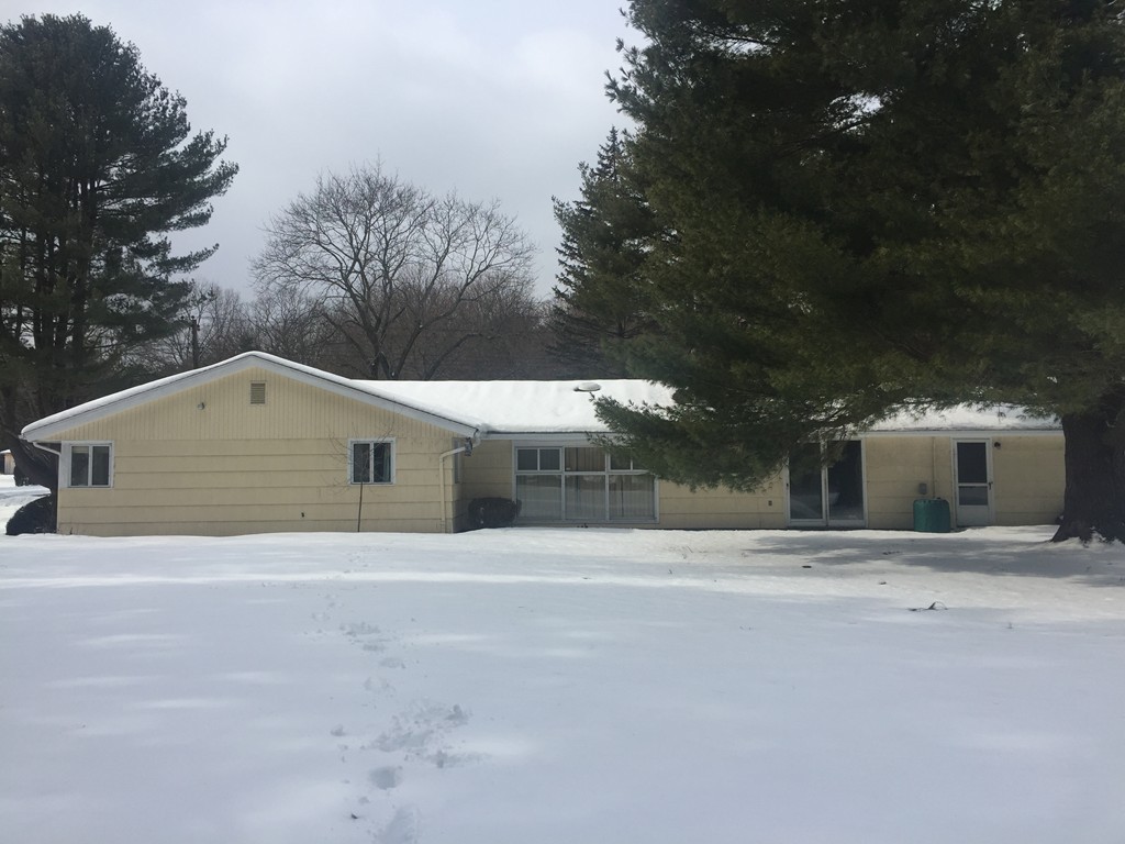 12 Nadine Road Framingham, MA 01701 - Photo 16 of 21 a front view of a house with a yard and garage