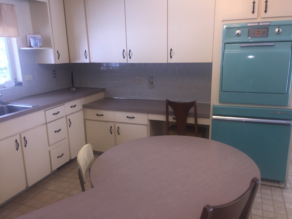 12 Nadine Road Framingham, MA 01701 - Photo 4 of 21 a kitchen with a sink and cabinets