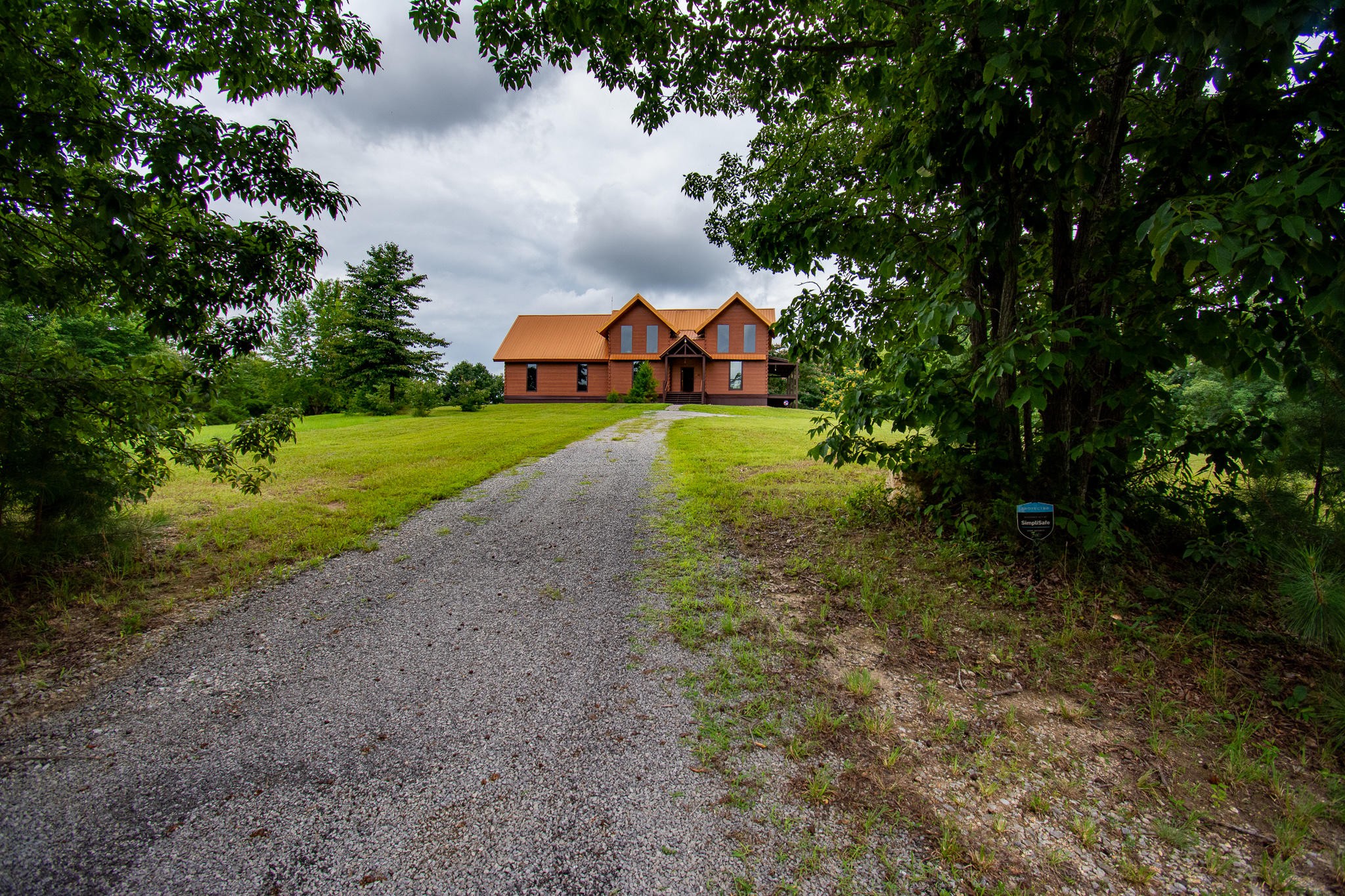 3600 Lynn Road Philadelphia, TN 37846 - Photo 3 of 37 a front view of a house with a yard and large trees