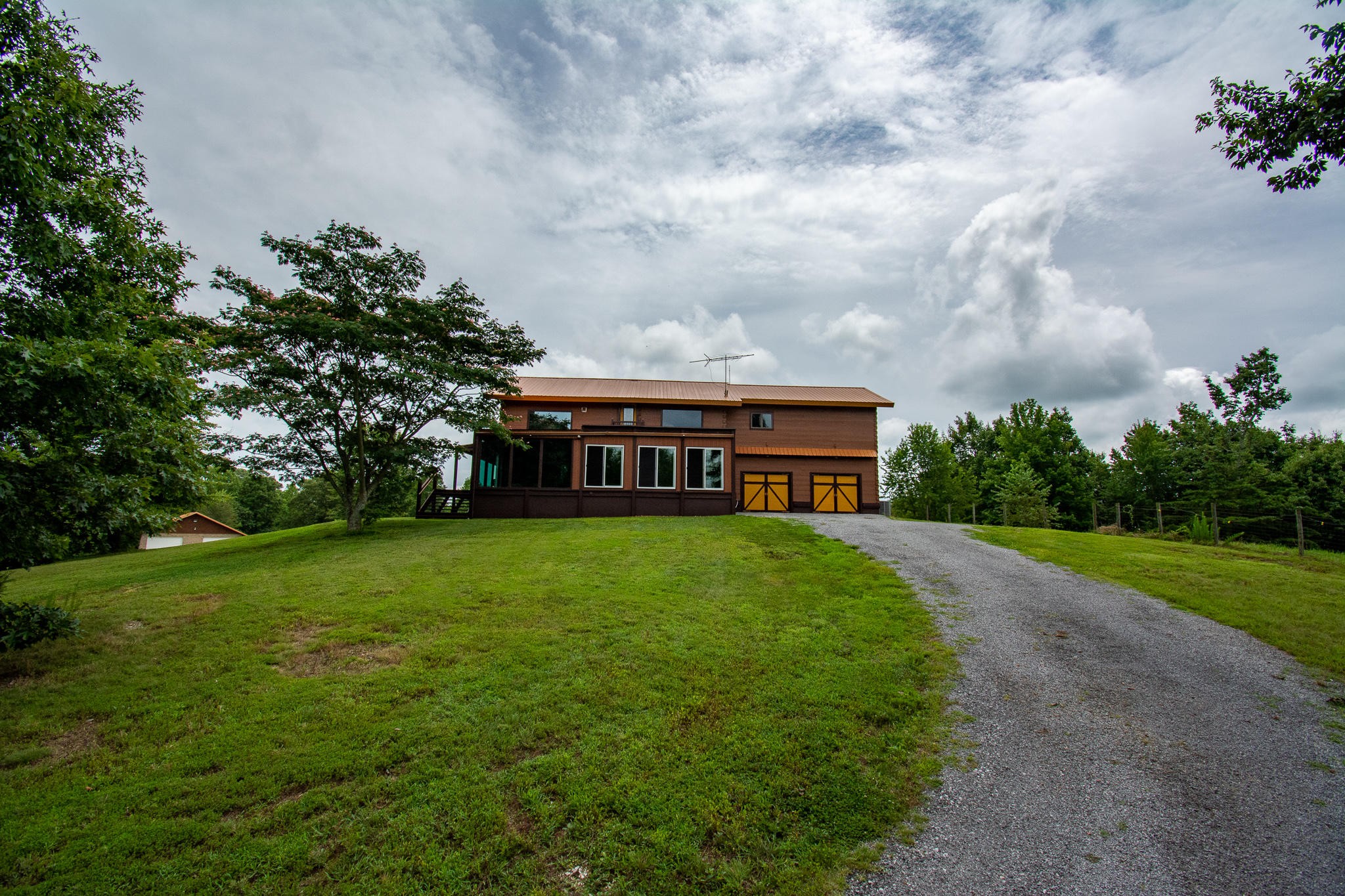 3600 Lynn Road Philadelphia, TN 37846 - Photo 35 of 37 a view of a big house with a big yard plants and large trees