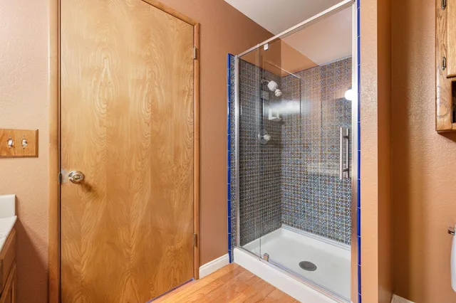 a spacious bedroom with a bed and a large window