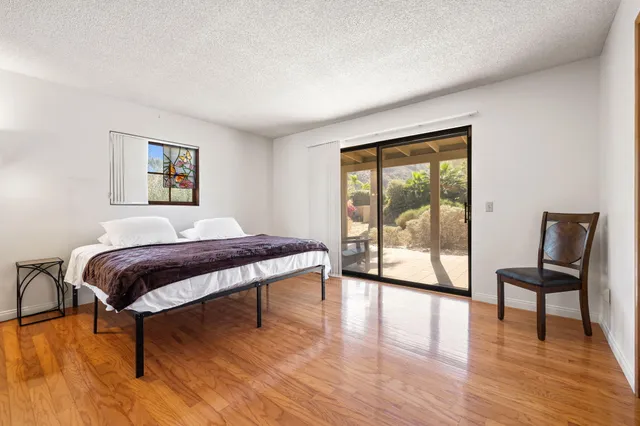 a livingroom with furniture and a workspace