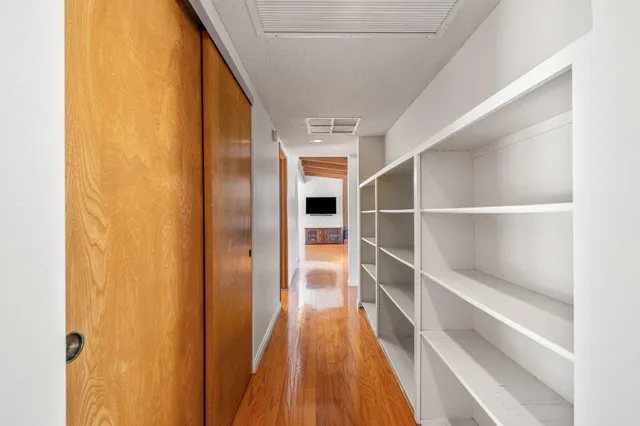 a bathroom with a glass shower door