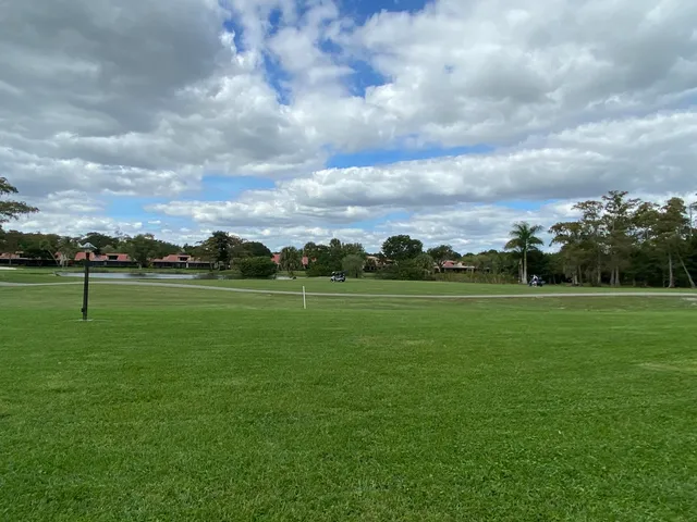 a view of a golf course with a lake