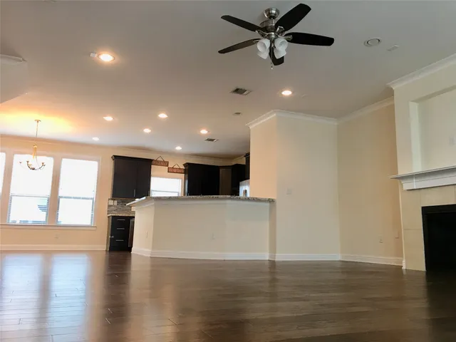 a view of a kitchen with a sink and a window