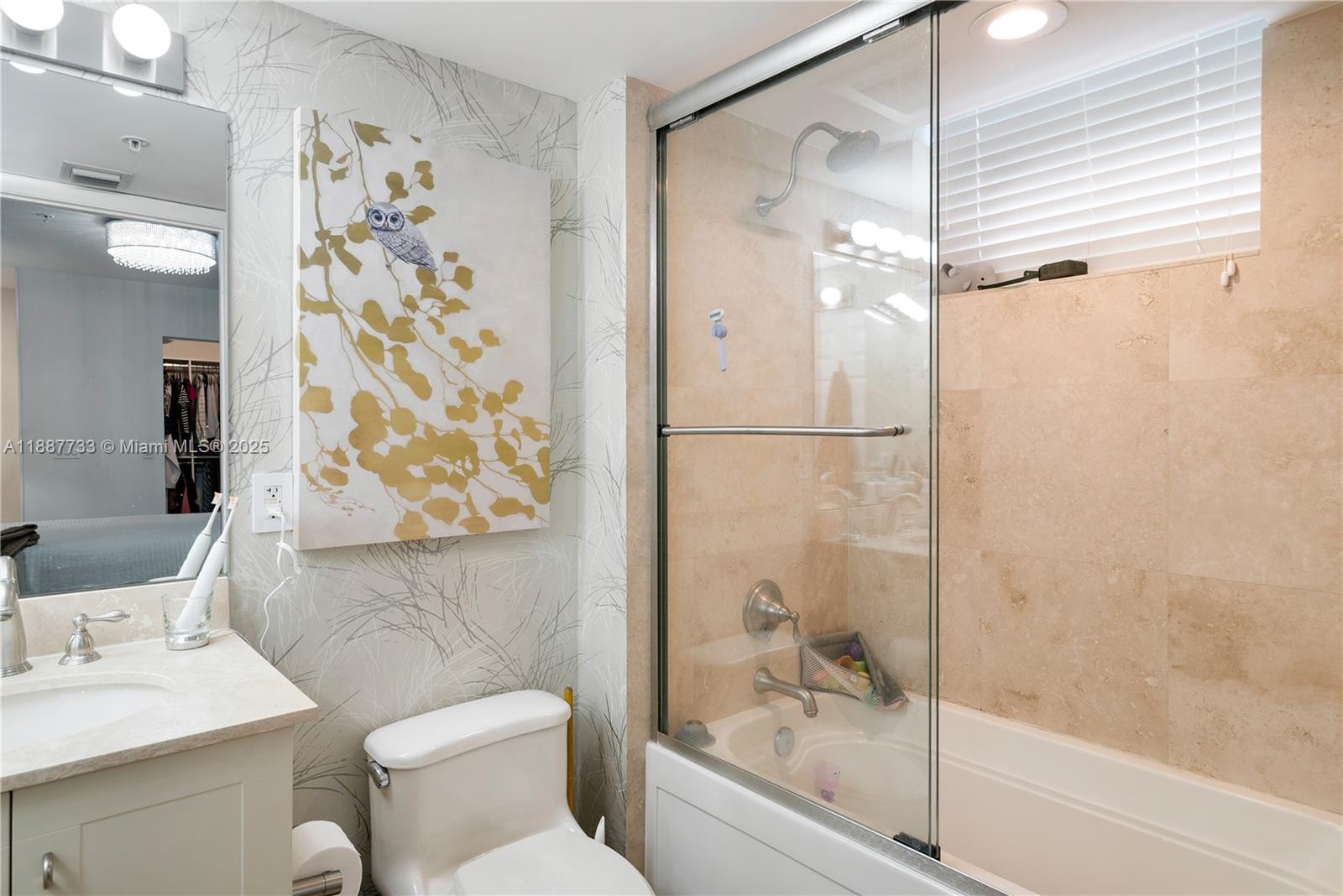 3232 Southwest 22nd Terrace, Unit TH 115 Miami, FL 33145 - Photo 13 of 17 a bathroom with a bathtub and shower