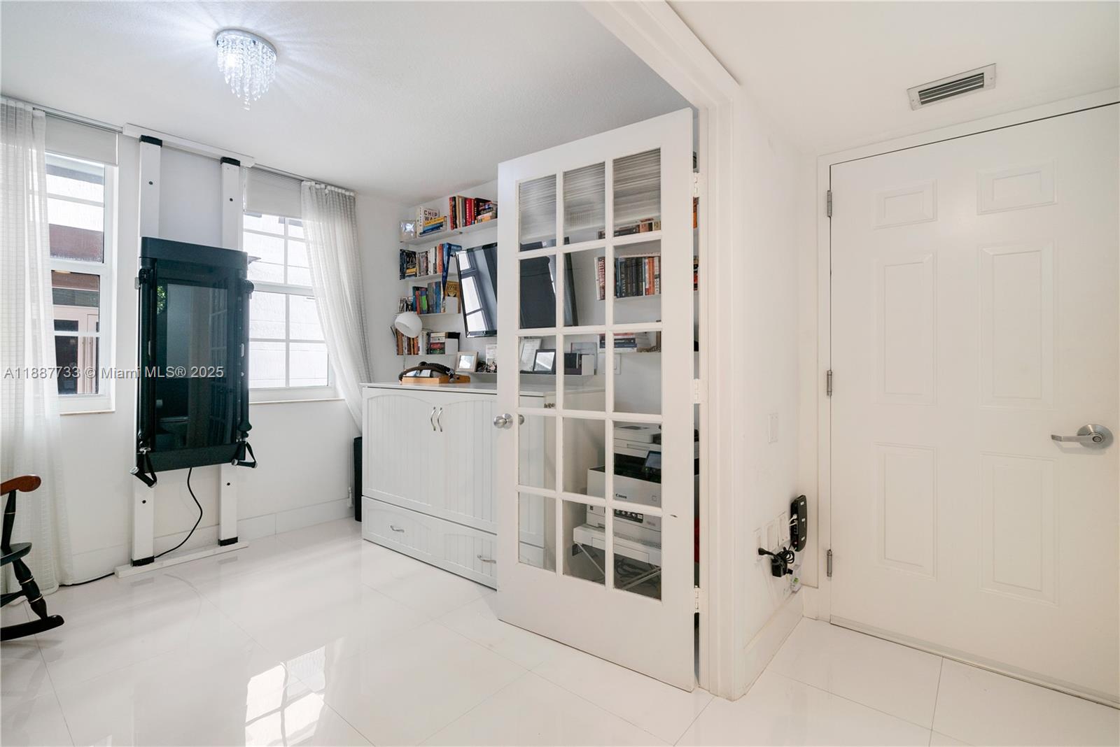 3232 Southwest 22nd Terrace, Unit TH 115 Miami, FL 33145 - Photo 9 of 17 a view of kitchen with refrigerator and window