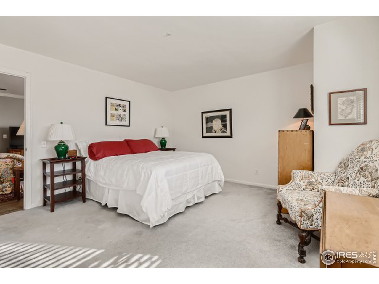 4915 Twin Lakes Road Boulder, CO 80301 - Photo 11 of 15 a bedroom with a bed and a painting on the wall