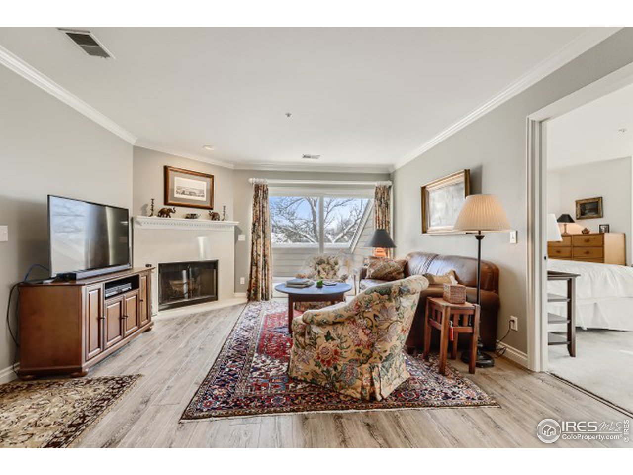4915 Twin Lakes Road Boulder, CO 80301 - Photo 3 of 15 a living room with furniture a flat screen tv and a fireplace
