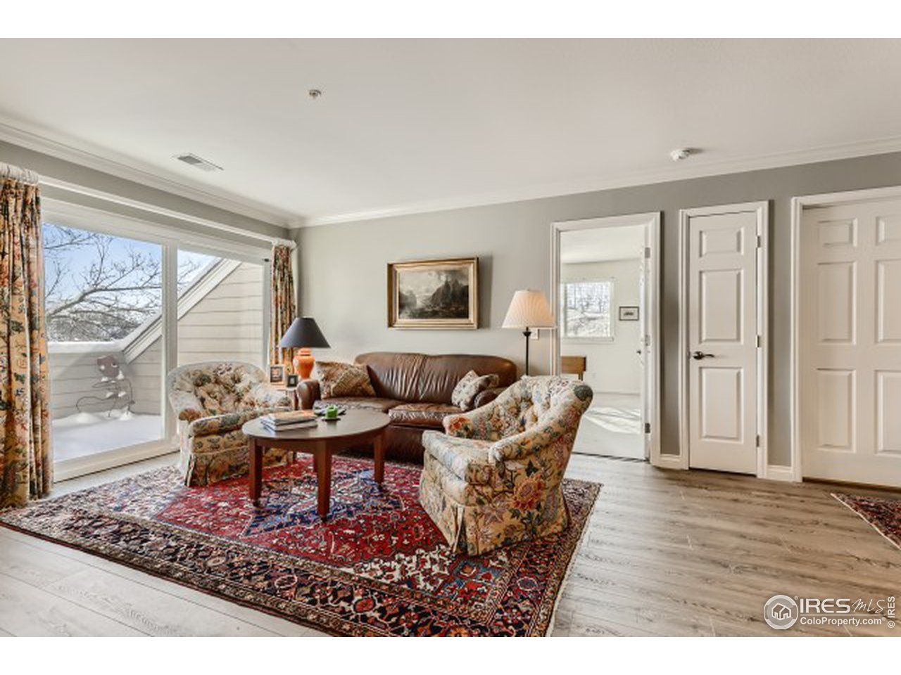 4915 Twin Lakes Road Boulder, CO 80301 - Photo 5 of 15 a living room with furniture a wooden floor and a large window