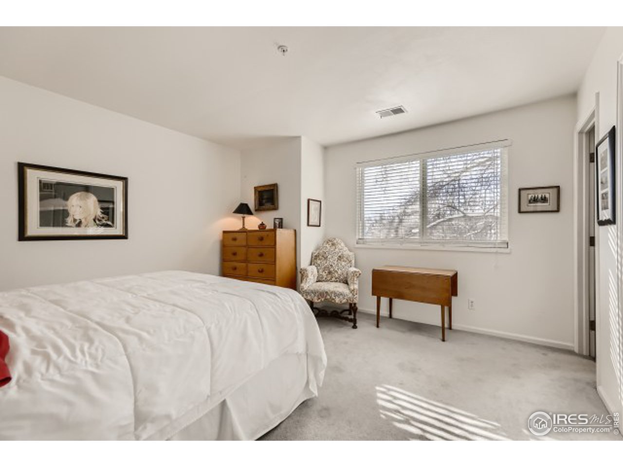 4915 Twin Lakes Road Boulder, CO 80301 - Photo 10 of 15 a bedroom with a bed and a large window