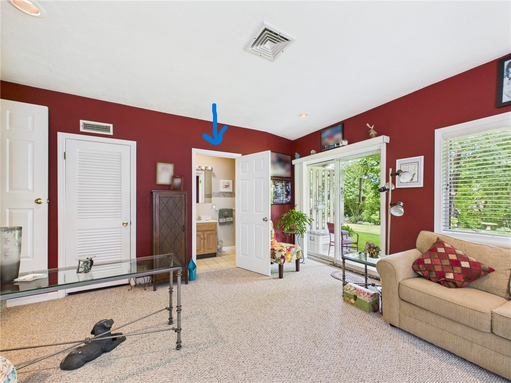 200 Cannon Street, Unit 130 Cranston, RI 02920 - Photo 16 of 26 Another angle. An open door to the bathroom in this suite w/its own entry for a potential in-law. Come and envision the placement of the kitchenette. Ask the listing agent to share her ideas! To left is door to utility room. The fastidious owner is a heating specialist and installed an Ultra Violet Purifier for Allergens on the A/C & Heat!