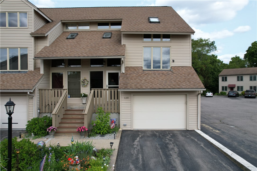 200 Cannon Street, Unit 130 Cranston, RI 02920 - Photo 2 of 26 This LOVELY end unit tri-level has tremendous curb appeal and a sunlit interior. This is a shot of the entrance w/private parking and garage.