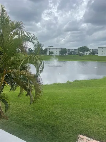 a view of a lake with a big yard