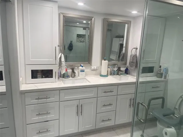 a bathroom with a sink and a mirror
