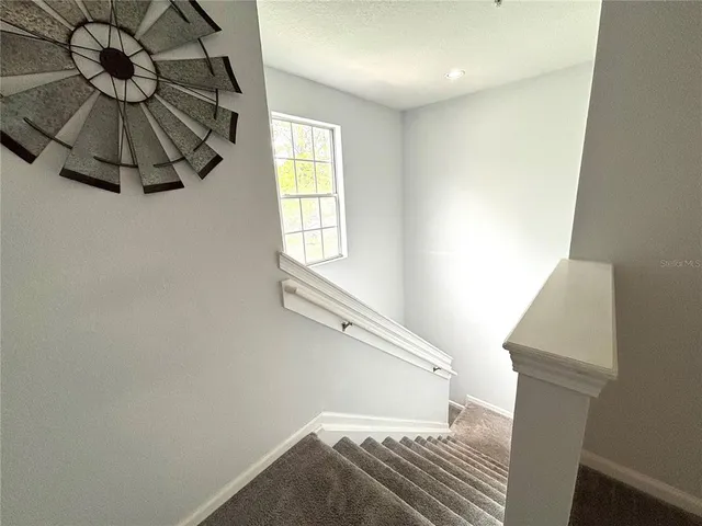 a view of entryway and hall with a window