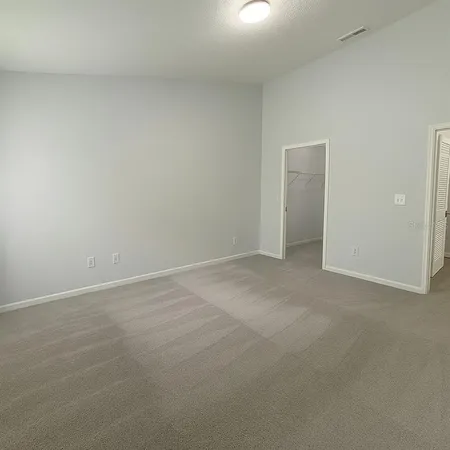 a view of an empty room and entryway