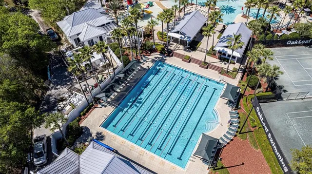 a view of swimming pool with outdoor seating
