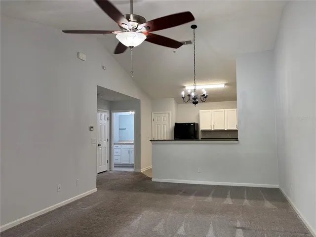 a view of a kitchen with a dishwasher and a ceiling fan