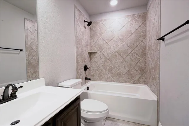 a bathroom with a sink a toilet and a bathtub