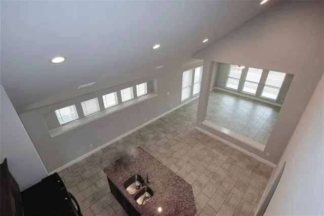 a view of a porch with a big yard and large tree