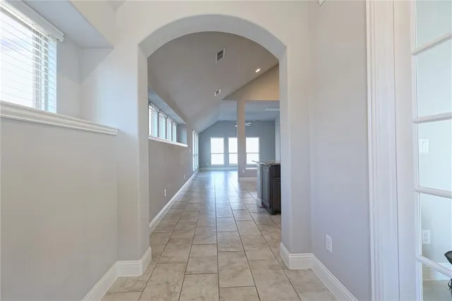 a hallway with windows