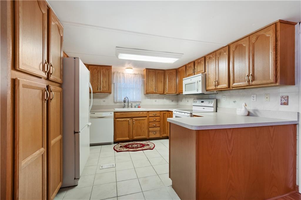 606 Bitner Road Dunbar, PA 15431 - Photo 14 of 21 a kitchen with stainless steel appliances granite countertop a refrigerator sink and cabinets