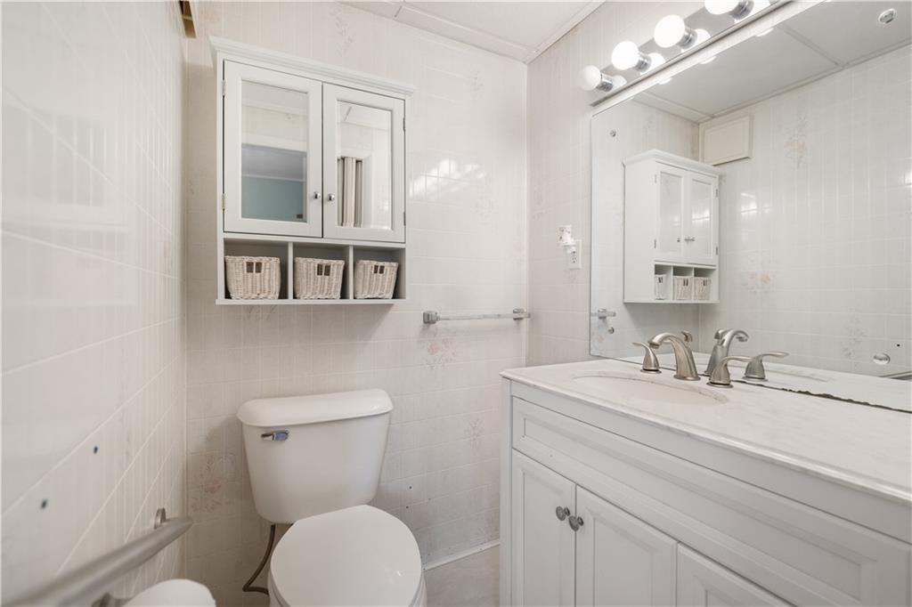 606 Bitner Road Dunbar, PA 15431 - Photo 8 of 21 a bathroom with a toilet a sink and mirror