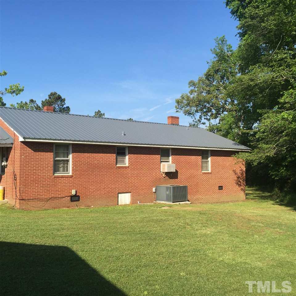 4845 Oxford Road Roxboro, NC 27574 - Photo 2 of 6 a front view of house with garden