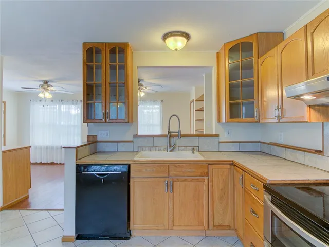 a kitchen with a sink and cabinets