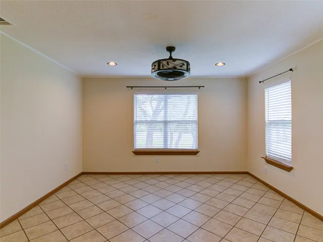 a bathroom with a shower curtain and a sink