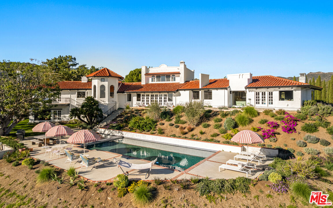 33261 Decker School Road Malibu, CA 90265 - Photo 2 of 32 a city view with tall buildings and cars park