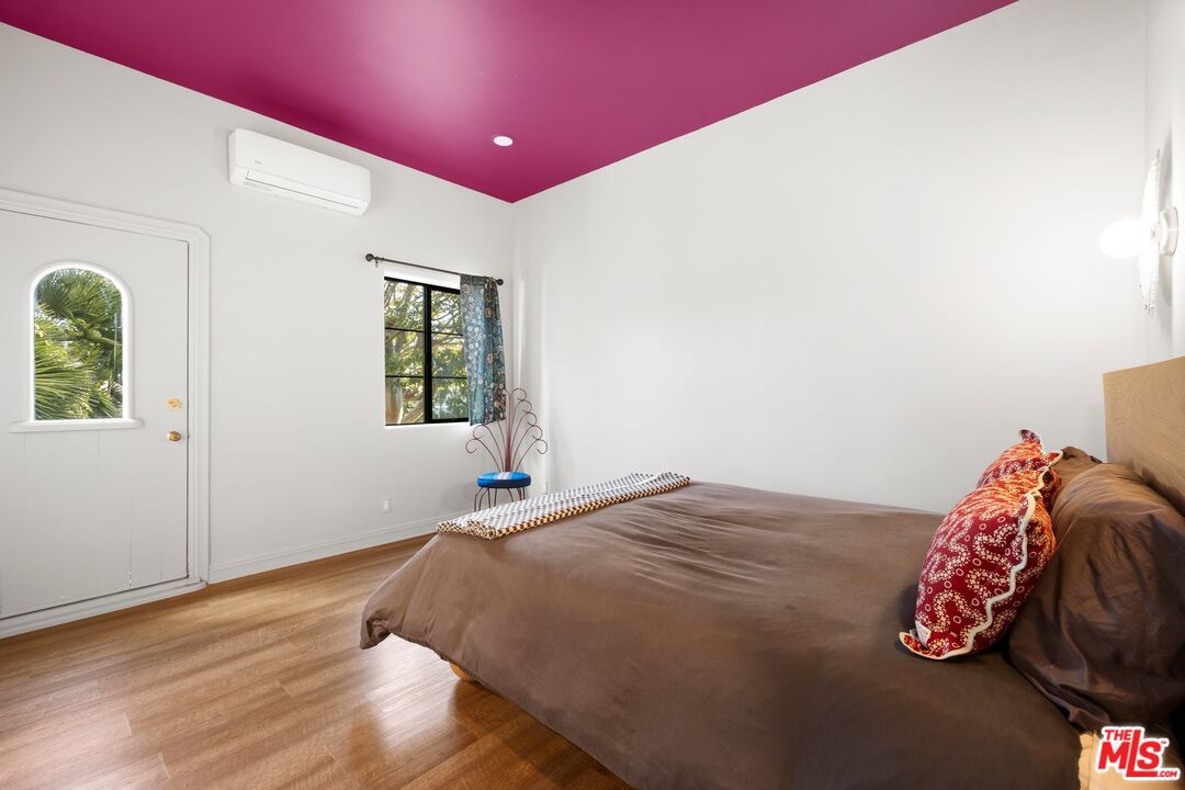 33261 Decker School Road Malibu, CA 90265 - Photo 24 of 32 a bed sitting in a bedroom next to a window