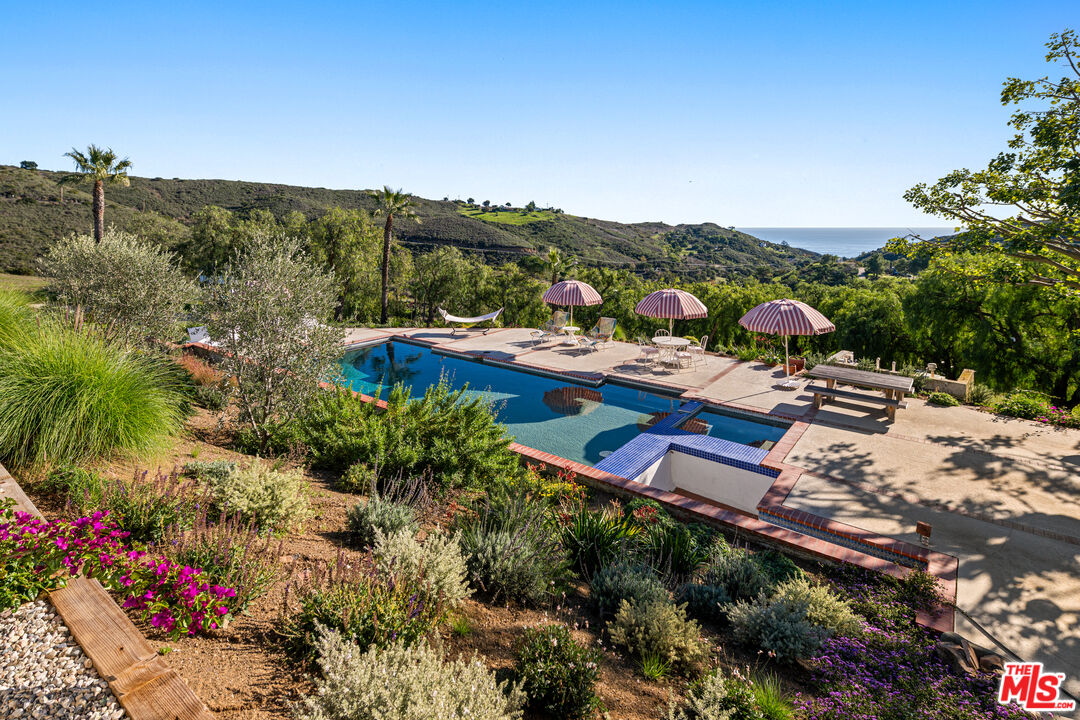 33261 Decker School Road Malibu, CA 90265 - Photo 30 of 32 a view of swimming pool with outdoor seating and mountain view in back