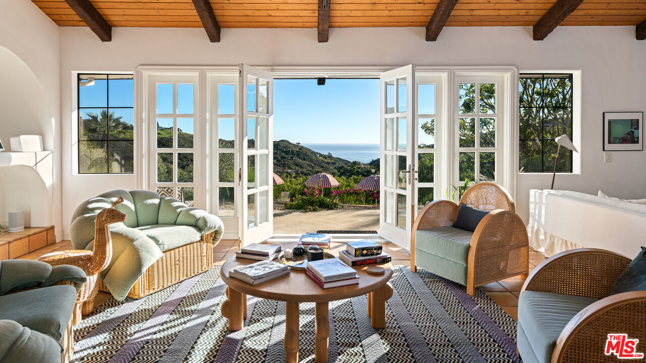 33261 Decker School Road Malibu, CA 90265 - Photo 5 of 32 a living room with furniture and a large window