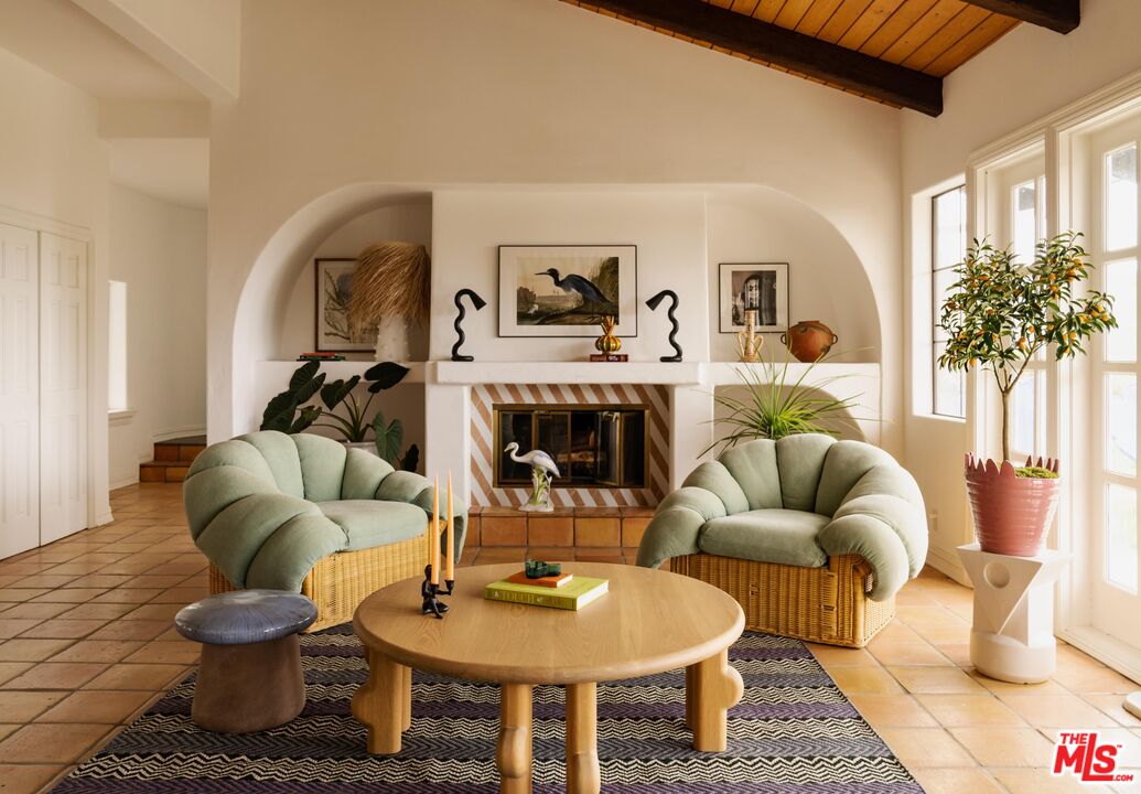 33261 Decker School Road Malibu, CA 90265 - Photo 9 of 32 a living room with furniture and a potted plant