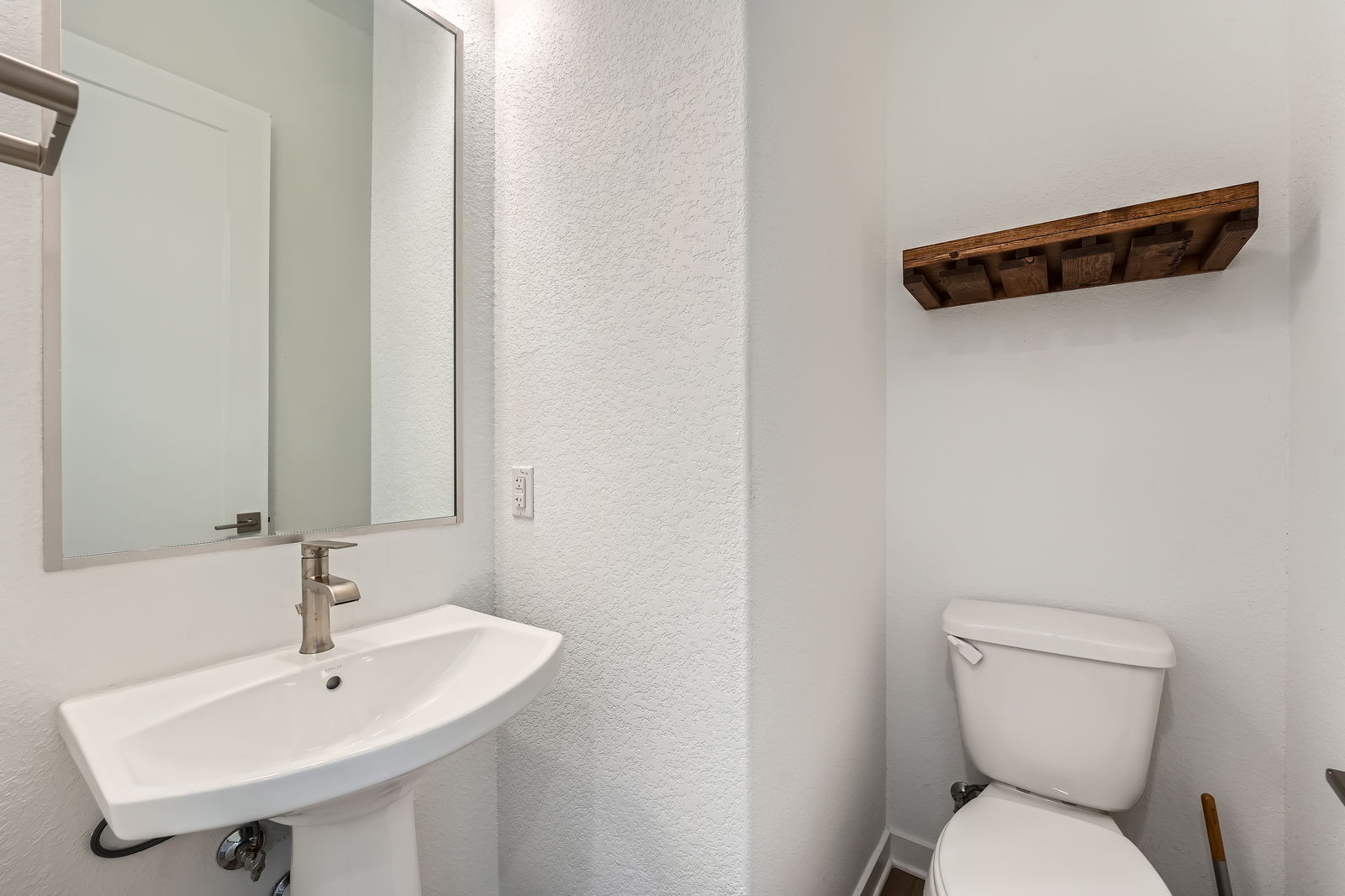 3213 Zach Scott Street Austin, TX 78723 - Photo 13 of 18 Half bathroom with a textured wall