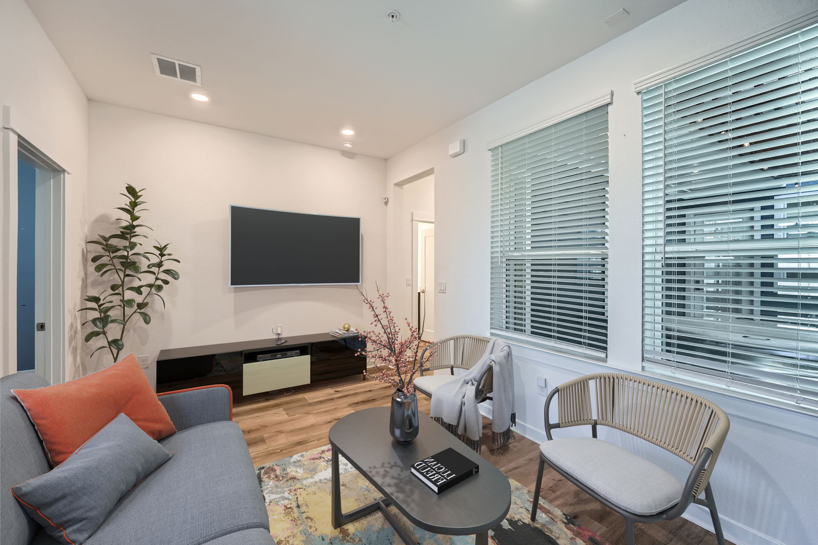 3213 Zach Scott Street Austin, TX 78723 - Photo 6 of 18 Living room with light wood-style floors and recessed lighting. Virtual staging