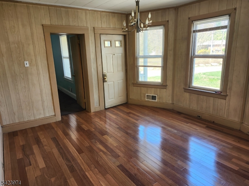 5 Locust Street Wanaque, NJ 07420 - Photo 13 of 23 an empty room with wooden floor and windows