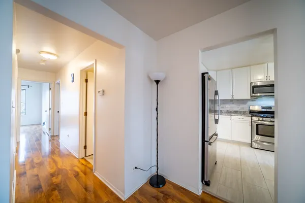 a view of a kitchen from the hallway