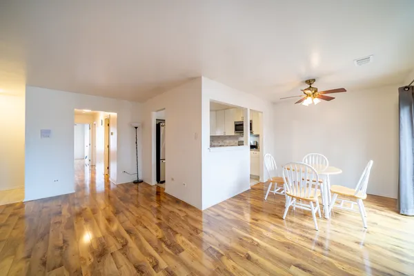 a view of a livingroom with a kitchen