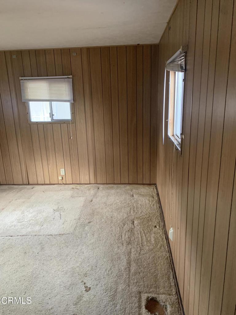 17900 Ocean Drive, Unit 40 Fort Bragg, CA 95437 - Photo 5 of 17 an empty room with wooden floor and windows