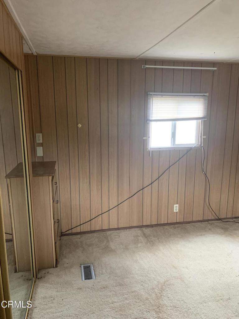 17900 Ocean Drive, Unit 40 Fort Bragg, CA 95437 - Photo 6 of 17 an empty room with wooden floor and windows