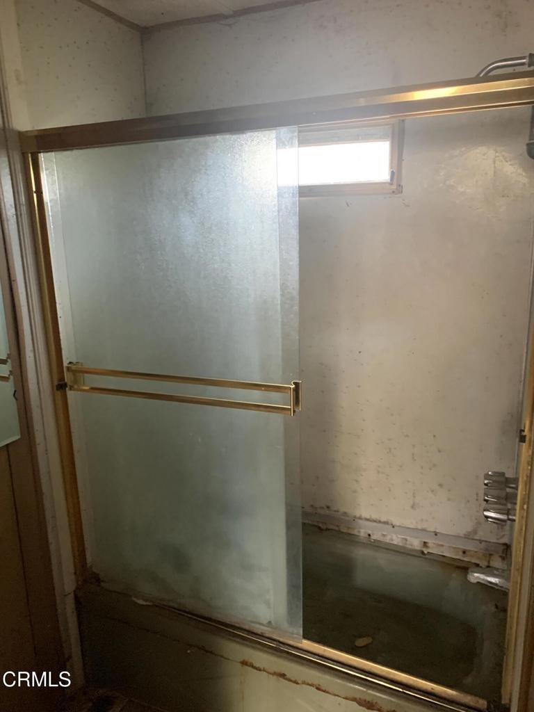 17900 Ocean Drive, Unit 40 Fort Bragg, CA 95437 - Photo 9 of 17 a bathroom with a glass shower door