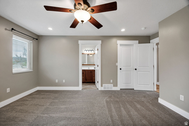 2912 South 1080th Street West Logan, UT 84321 - Photo 11 of 43 Carpeted room with a ceiling fan featuring integrated lighting and recessed lighting