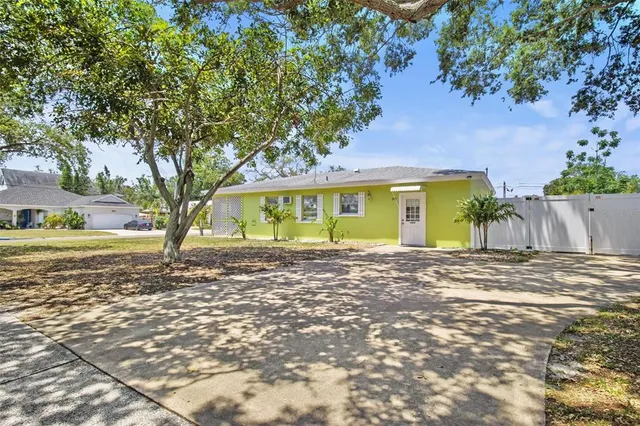 a view of a house with a yard and garage