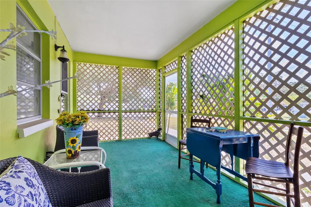 504 Milwaukee Avenue, Unit A Dunedin, FL 34698 - Photo 11 of 27 a living room with furniture and a potted plant