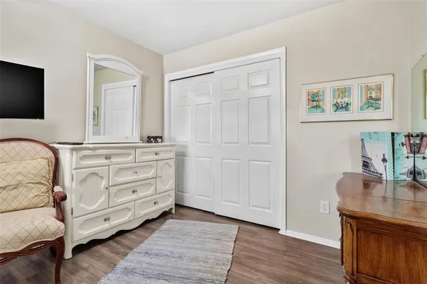 a room with a couch and a wooden floor