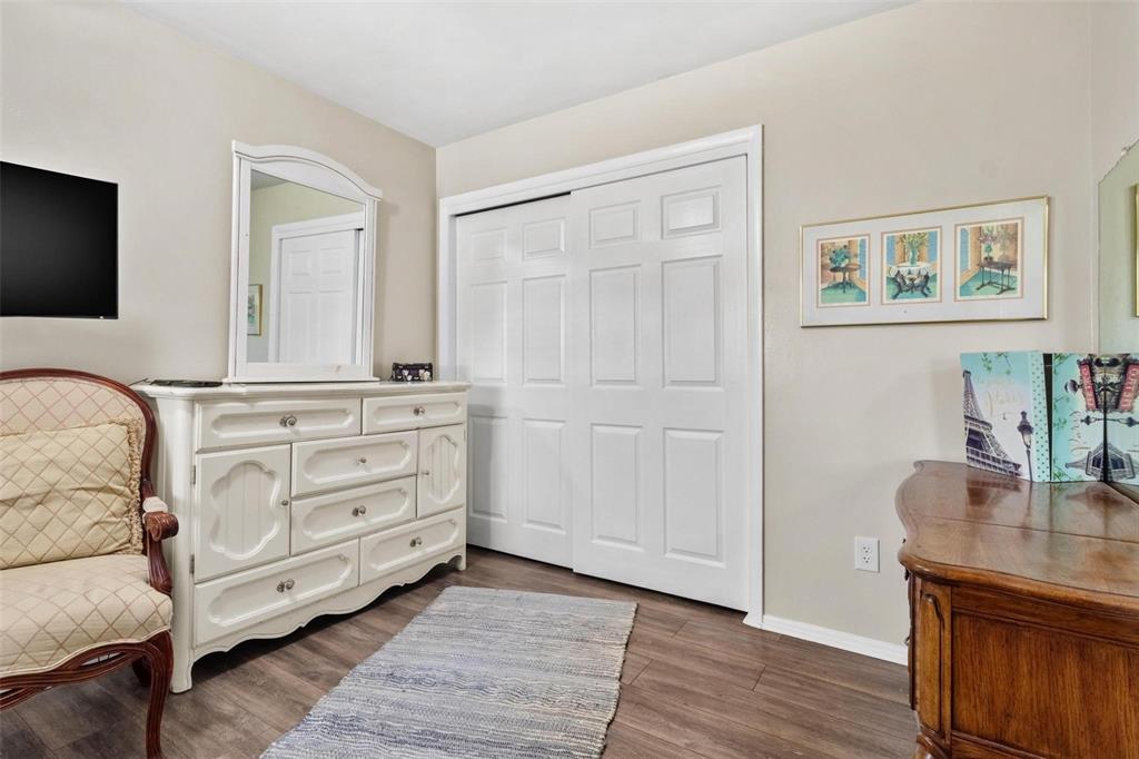 504 Milwaukee Avenue, Unit A Dunedin, FL 34698 - Photo 13 of 27 a room with a couch and a wooden floor