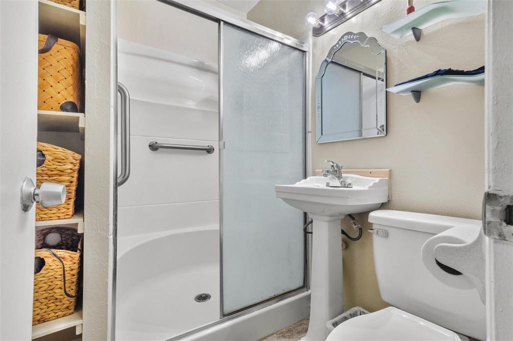504 Milwaukee Avenue, Unit A Dunedin, FL 34698 - Photo 16 of 27 a bathroom with a sink toilet and shower